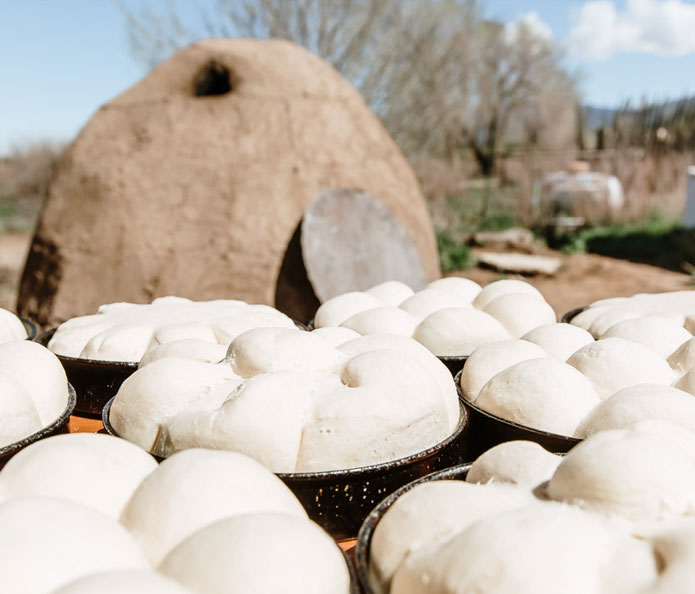 Bread loaves before entering the horno in Taos Pueblo, New Mexico.
