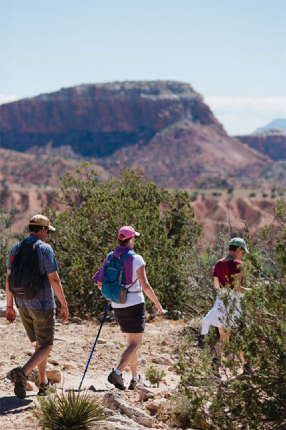Three hiking guests in Ghost Ranch, New Mexico.